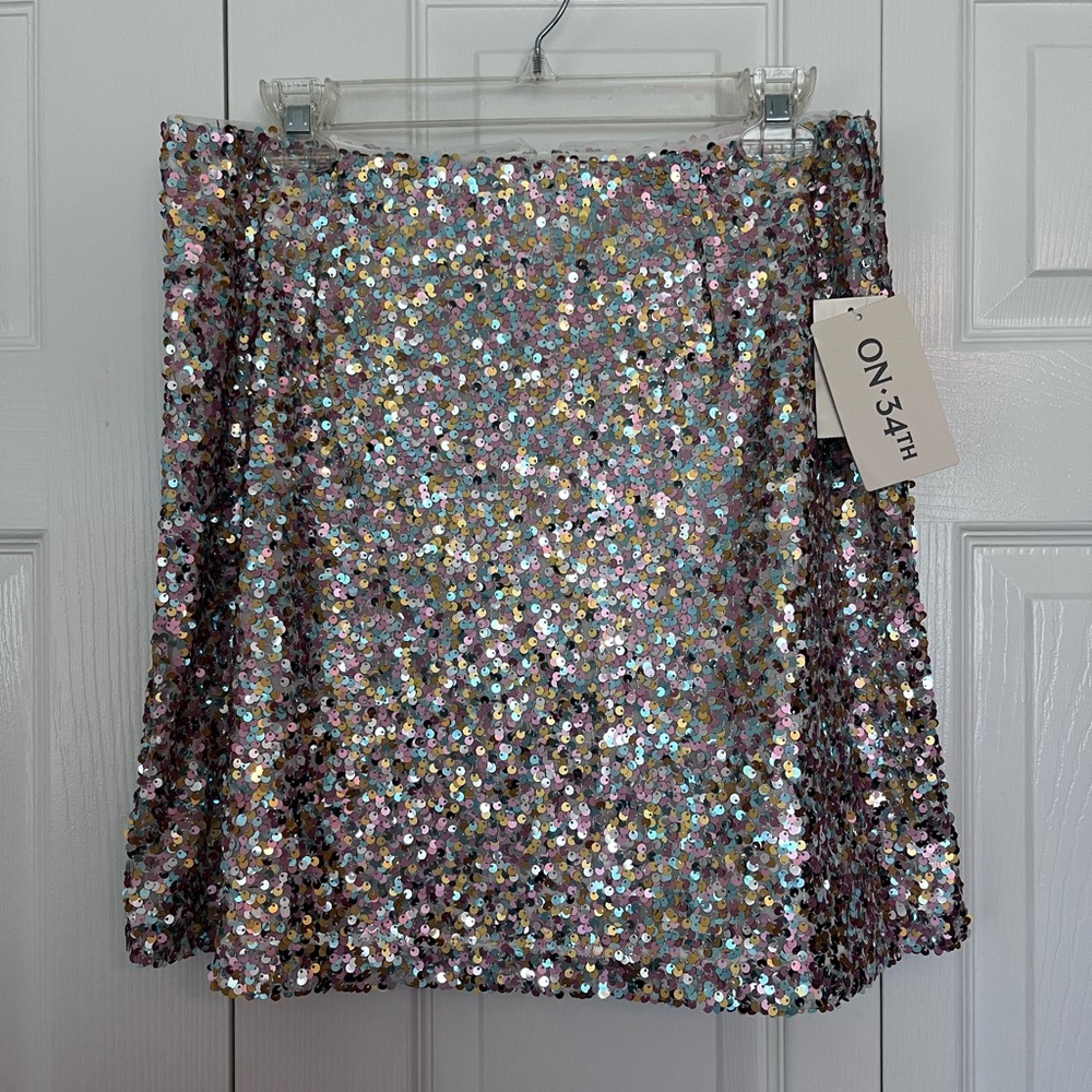 NWT On 34th sequin mini skirt size 8. Pink, light blue and gold sequins.